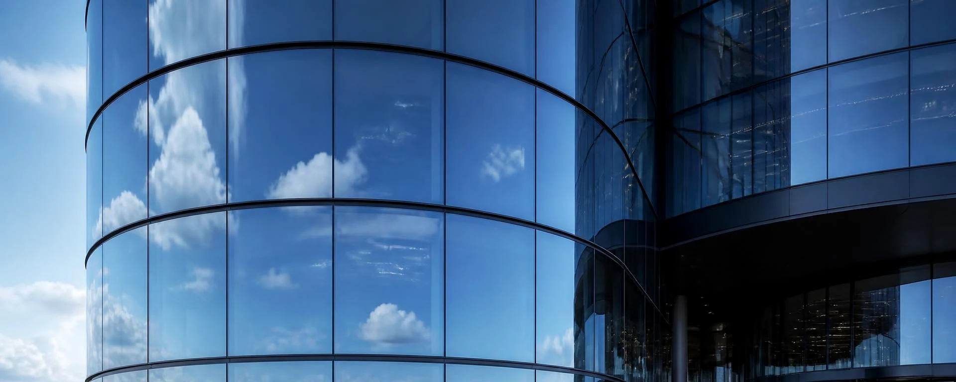 Radiused glazing in service on a curved curtain wall assembly